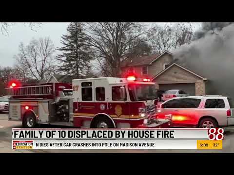 Family of 10 displaced by house fire
