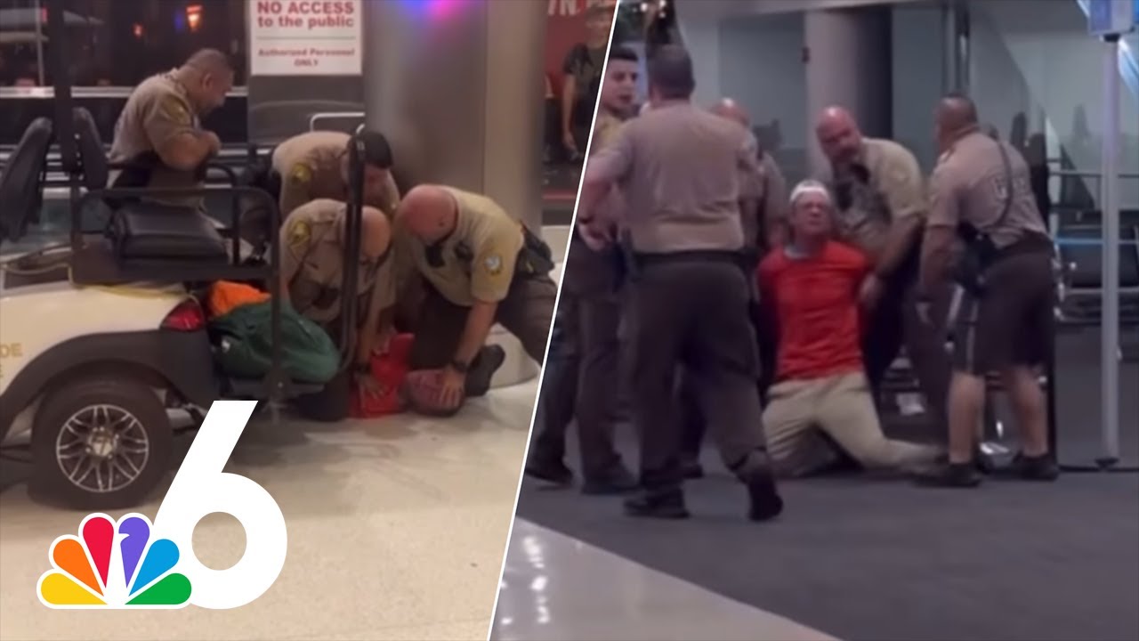 Dramatic video shows man with bloody hand screaming racial slurs, resisting officers at MIA