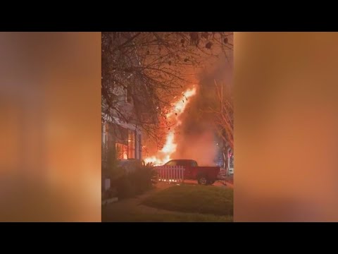 Cellphone video shows flames shooting through home