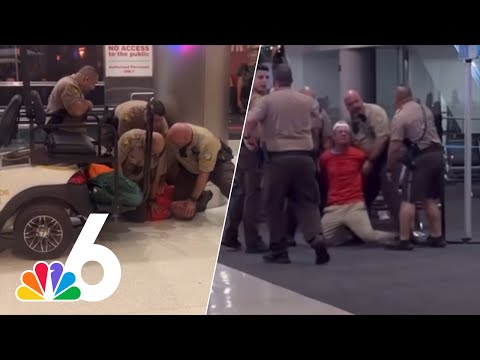 Dramatic video shows man with bloody hand screaming racial slurs, resisting officers at MIA