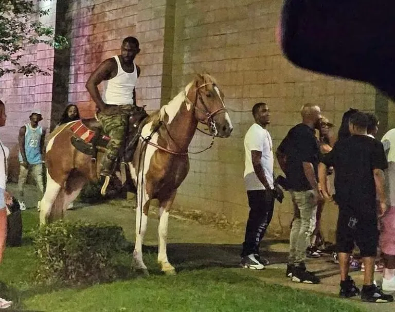 La Darrius Means was on his horse, Chief, giving out a business car Tuesday, Aug. 22, 2023, when someone took a picture of him that made it look like was waiting to get in Platinum of Birmingham.