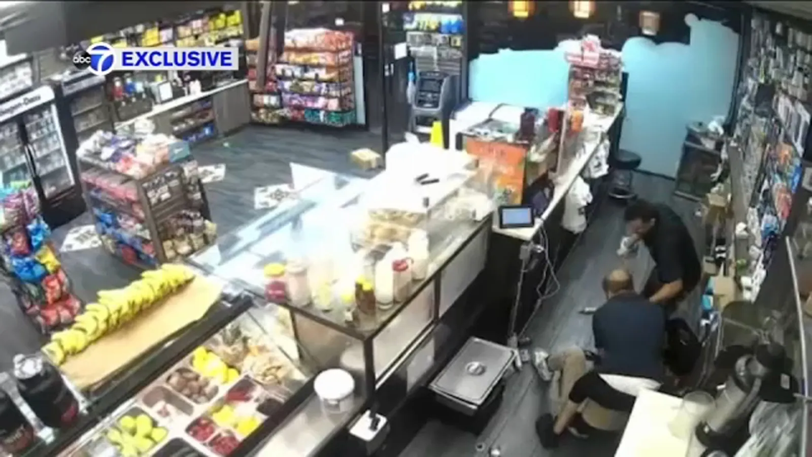 Exclusive footage shows employees fighting off robbers during a deli robbery