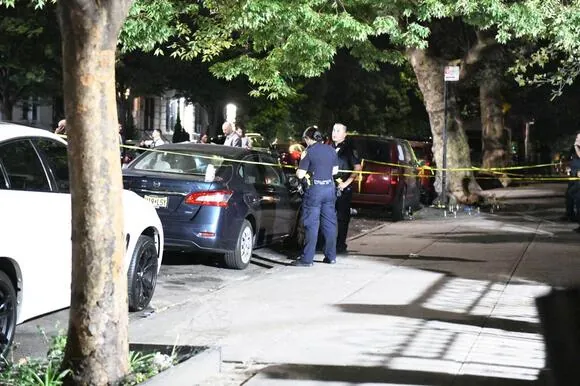 NYPD officers investigate the scene where a man was fatally shot on Monday, Sept. 4, 2023.
