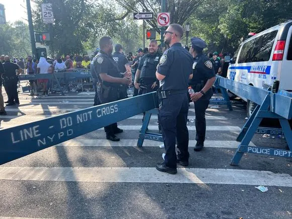 Police at the scene of a shooting along the West Indian Day Parade route near Eastern Parkway and Franklin Avenue.
