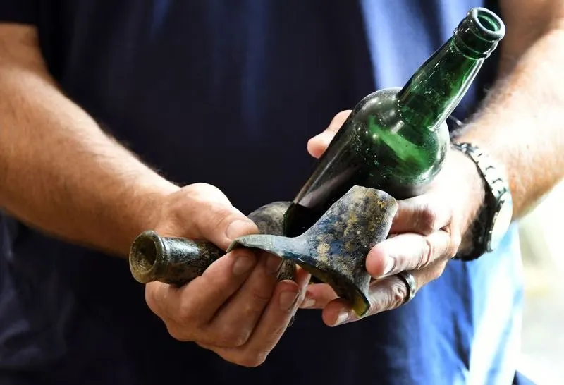 Steve Nagiewicz, a marine archaeologist, diver and adjunct professor of Marine Science at Stockton University, shows shipwreck artifacts f