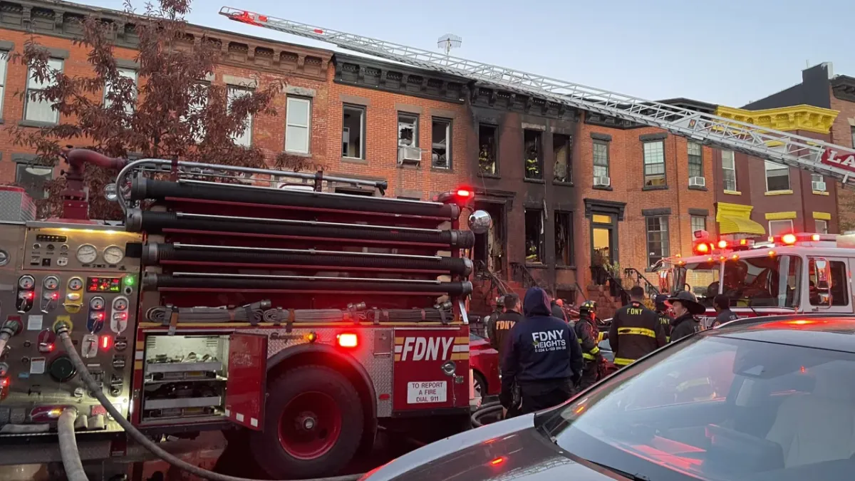 fire in a Brooklyn brownstone killed 3 and injured nearly a dozen