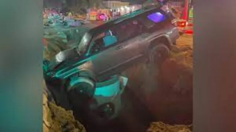 SUV driver rescued after being trapped in manhole construction site in Galveston