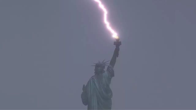 Incredible images capture boat sinking and lightning hitting Statue of Liberty during intense New York storm