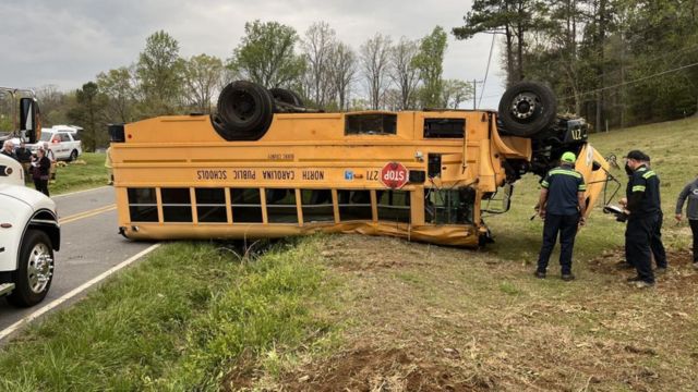 School bus overturns in North Carolina, resulting in 1 person airlifted and 10 others injured